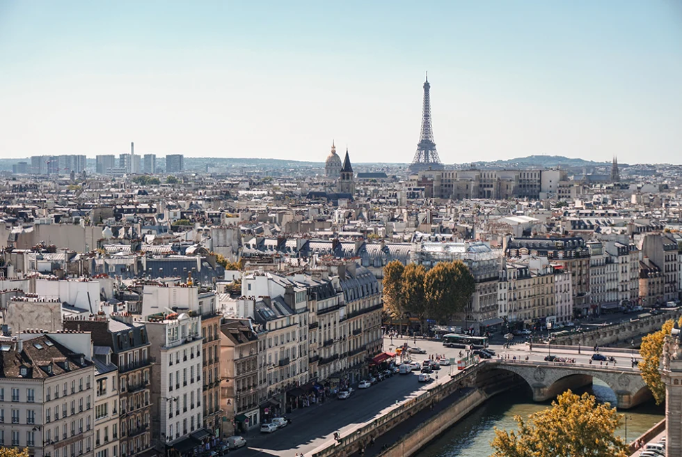 City overlook in Paris France with blue skies and view of the river and bridge