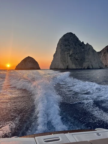 A picture of boating in the sea during sunset