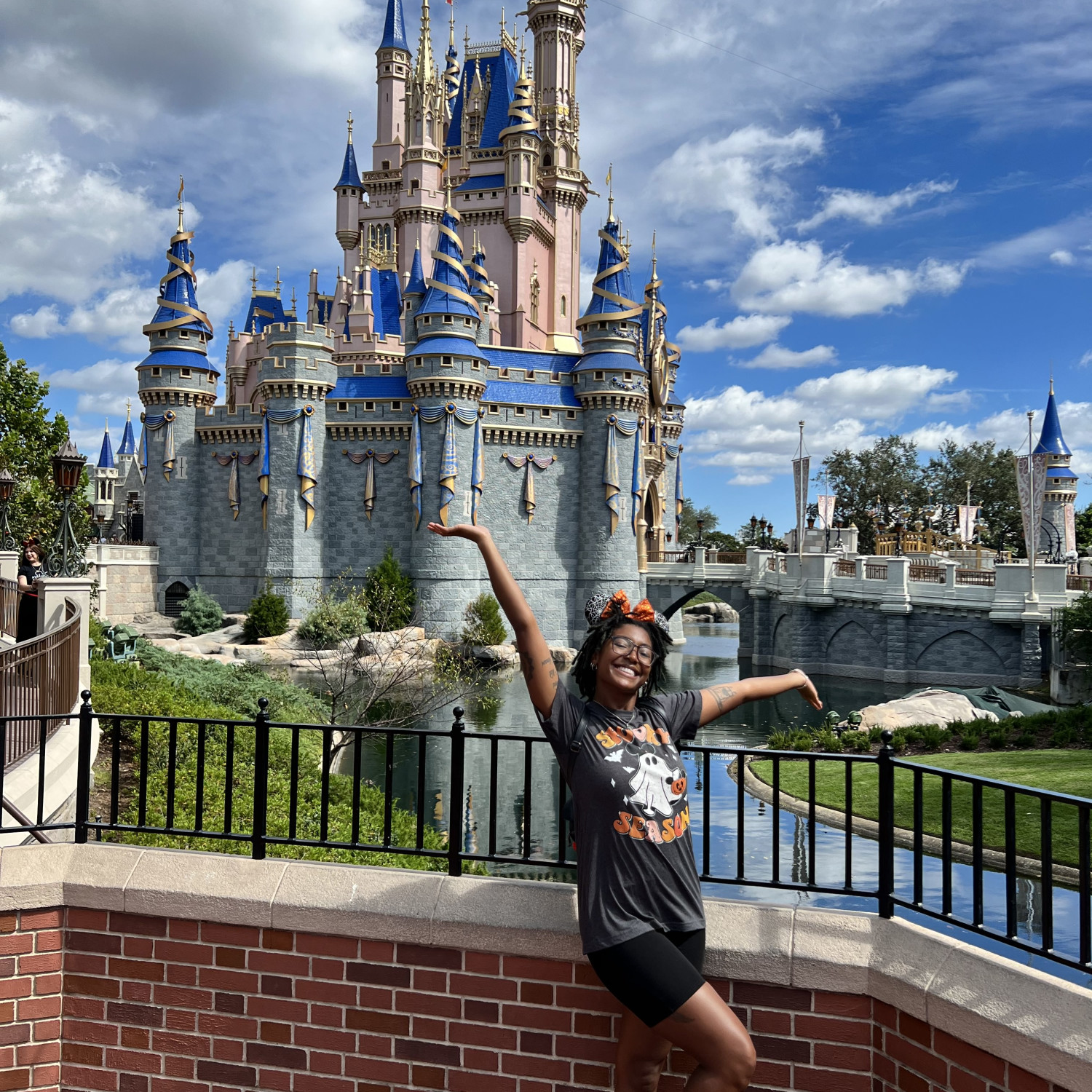 Travel advisor posing in front of Disney land