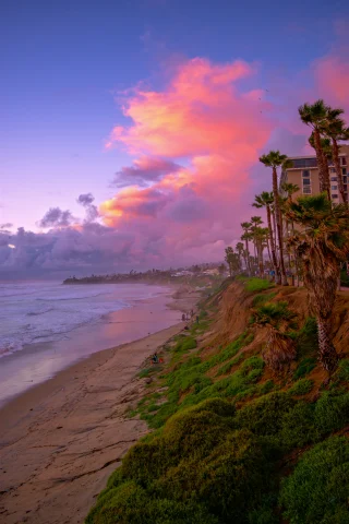 Seashore under orange and pink skies at Pacific Beach, San Diego.