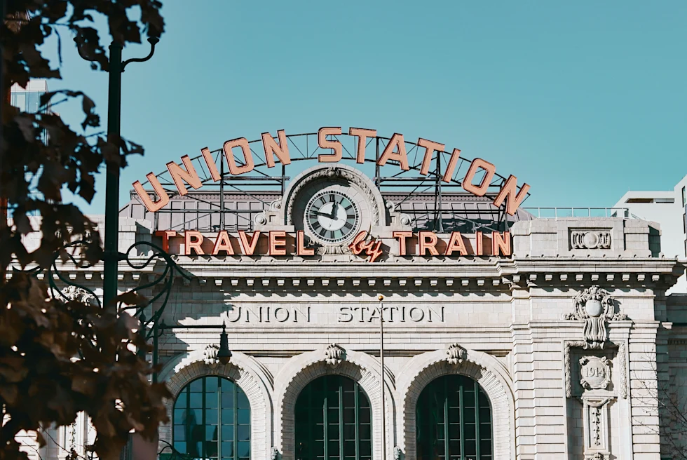 large white building with red sign during daytime