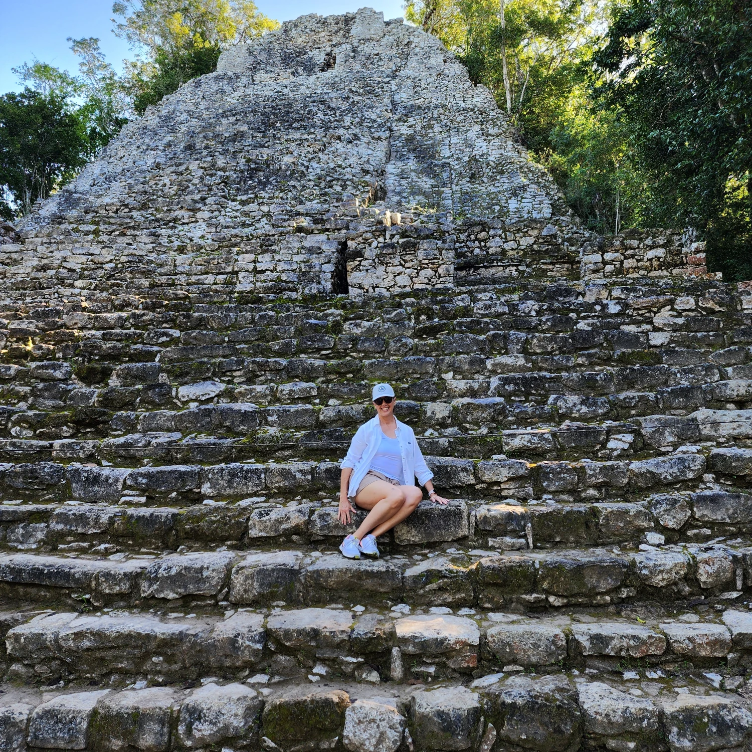 Travel advisor posing on stairs