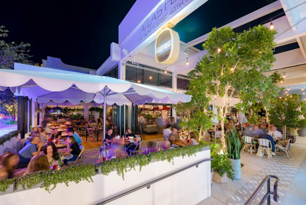 A restaurant at night, people having meal.