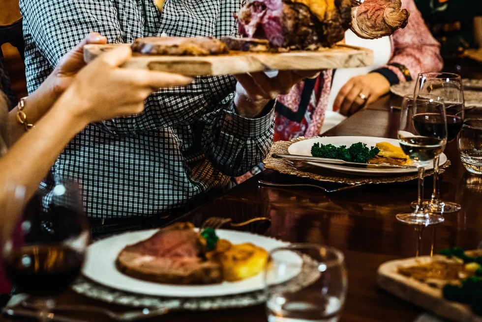 people eating a roast