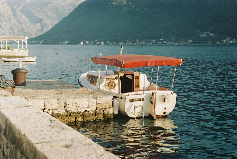 A small boat to tour Kotor Bay.