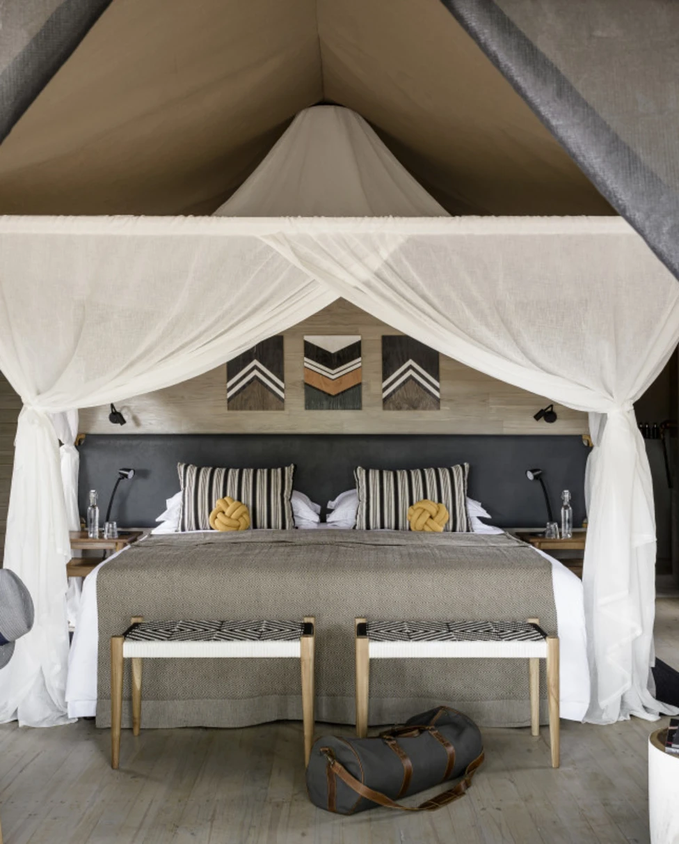 four-poster bed in a luxe safari tent