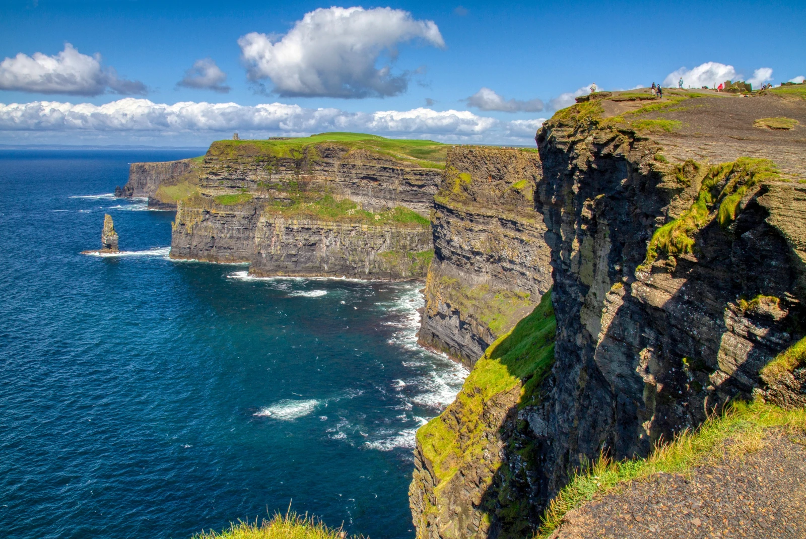 The Cliffs of Moher in Ireland are nature's towering masterpiece, offering awe-inspiring coastal vistas that blend dramatic cliffs with the wild beauty of the Atlantic Ocean.