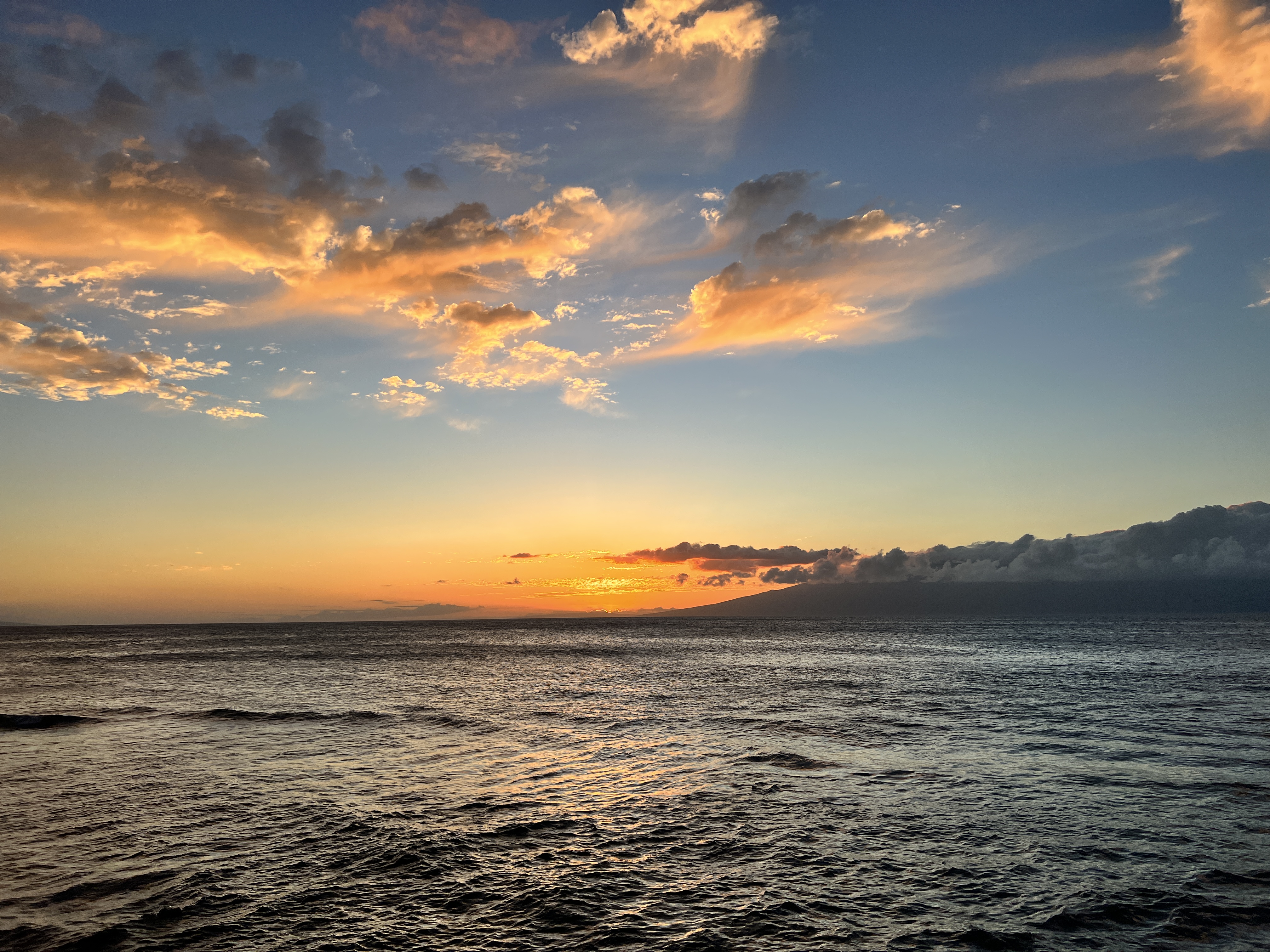 body of water during sunset