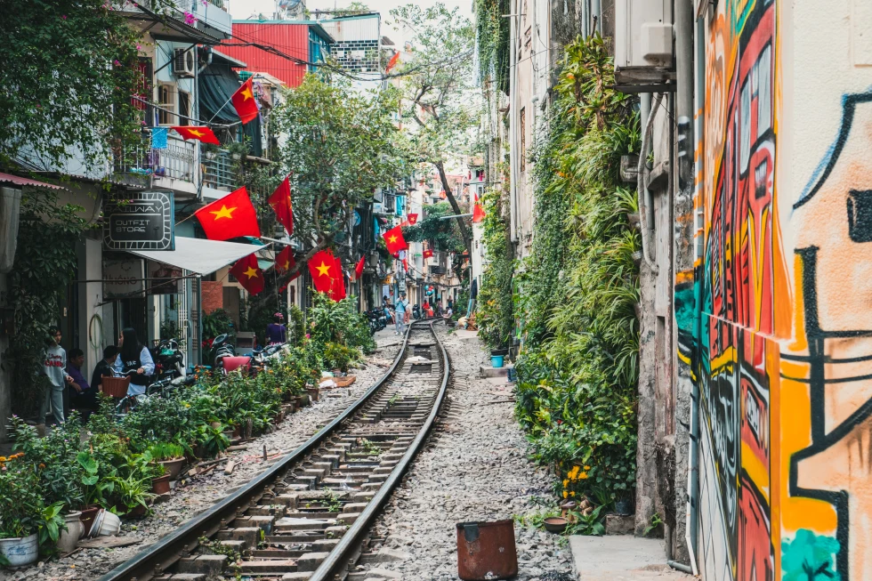 A green street and rail tracks in Hanoi. 
