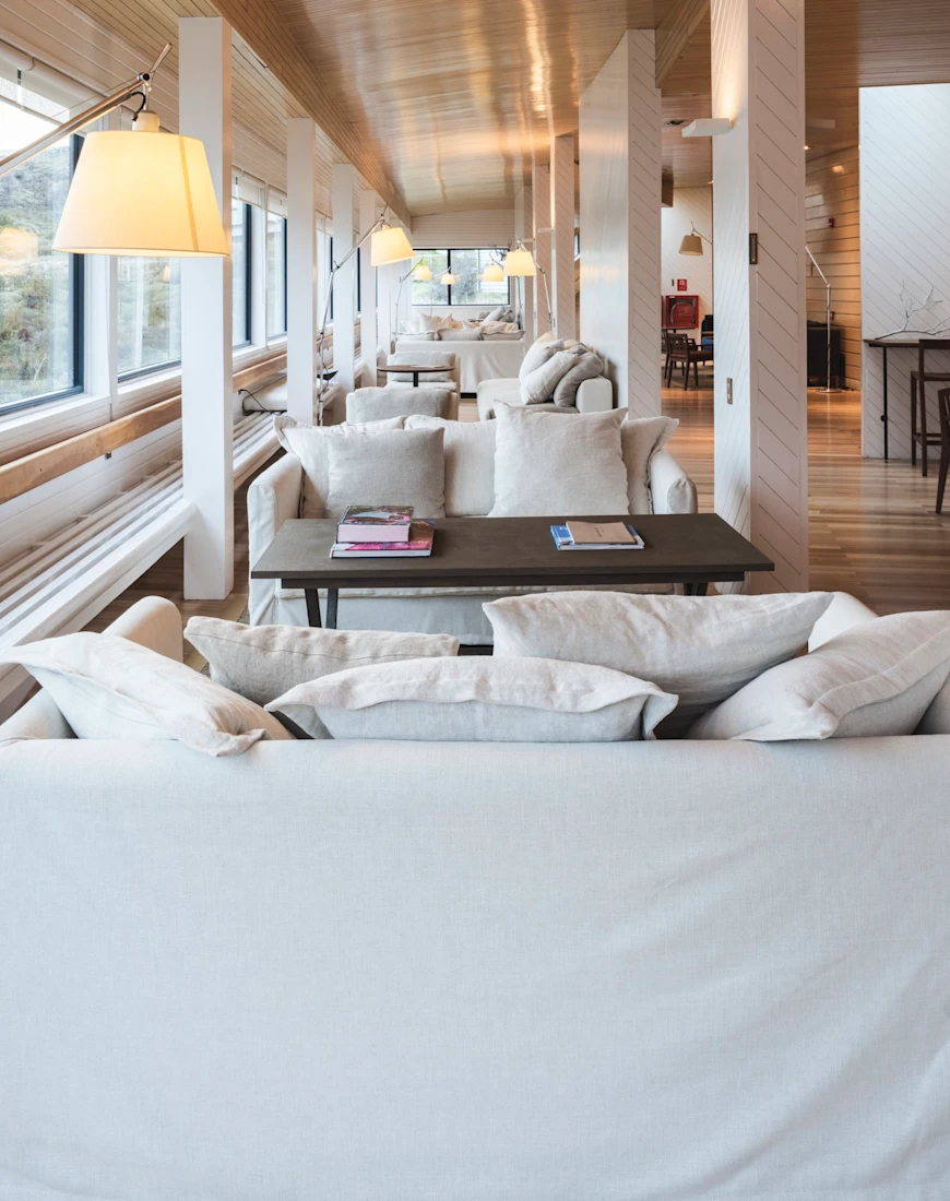 large living room with beams and white couches
