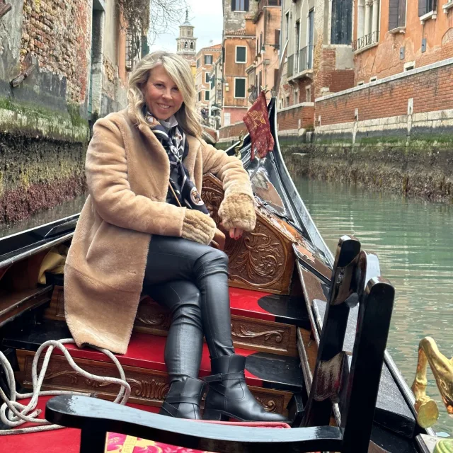 Travel advisor Kelli Walden riding on a Venetian gondola.