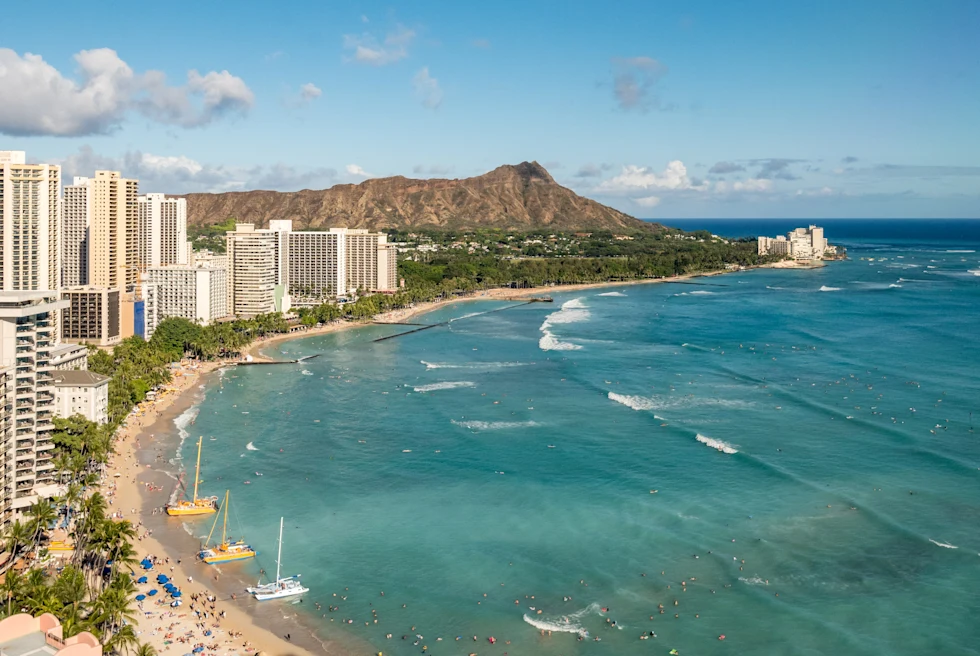 aerial view of ocean and beaches with tall buildings