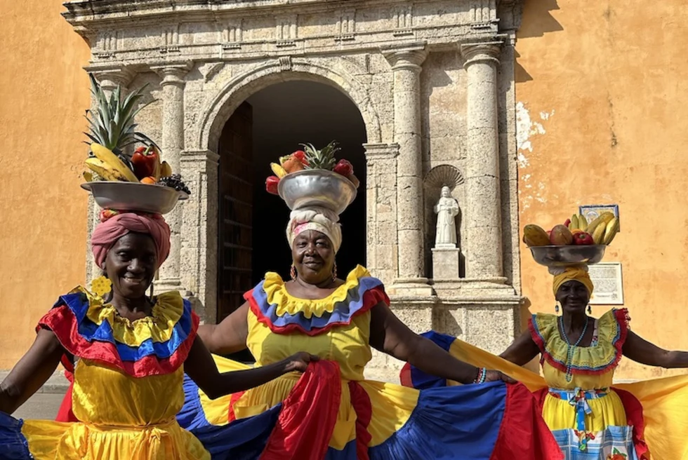 Women with colorful outfits in Cartagena.