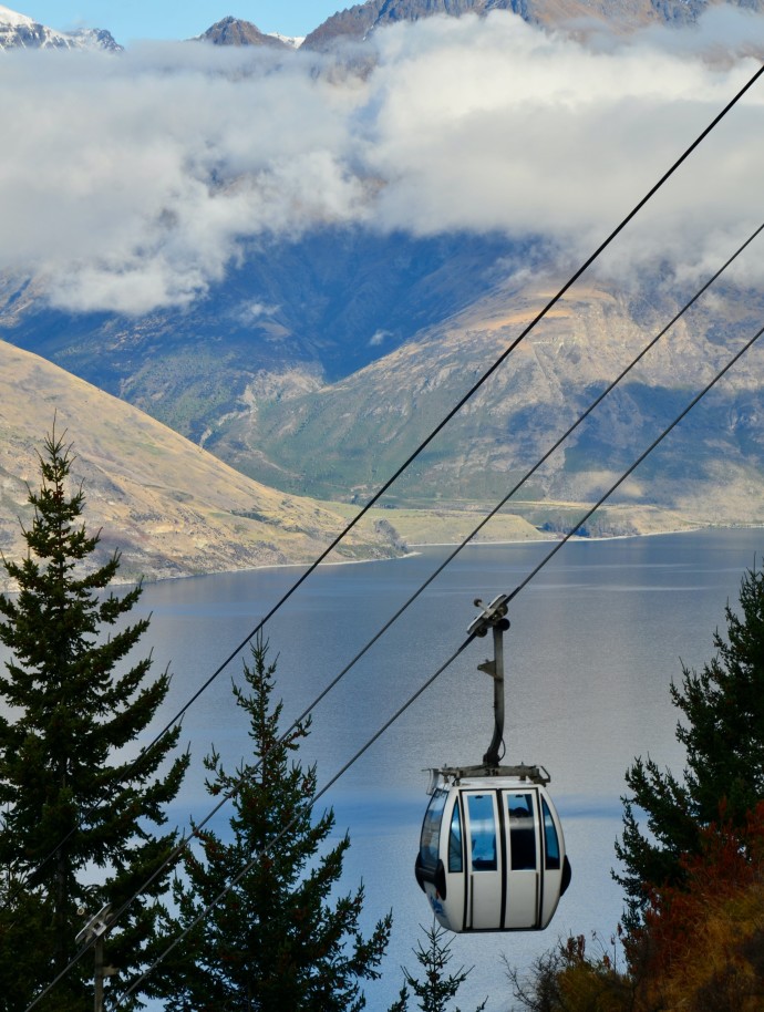 Gondola with mountains and lake in the background in Queensland, New Zealand
