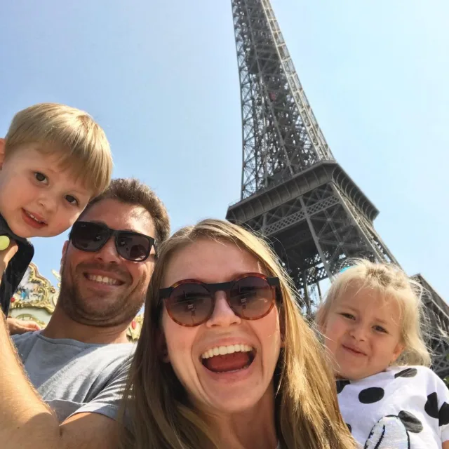 Picture of Kamilla Litvinov with her family in front of Eiffel tower