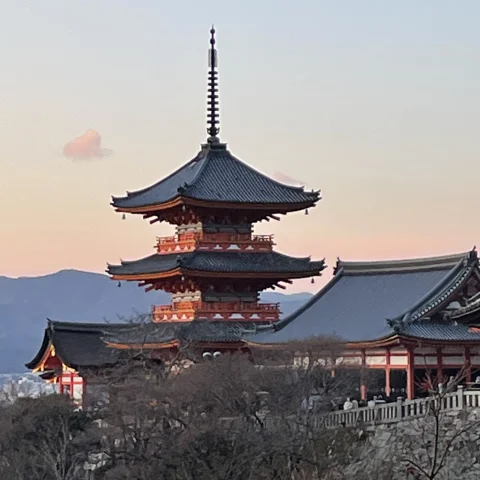 Kiyomizu-dera Temple in Kyoto in front of a sunset sky