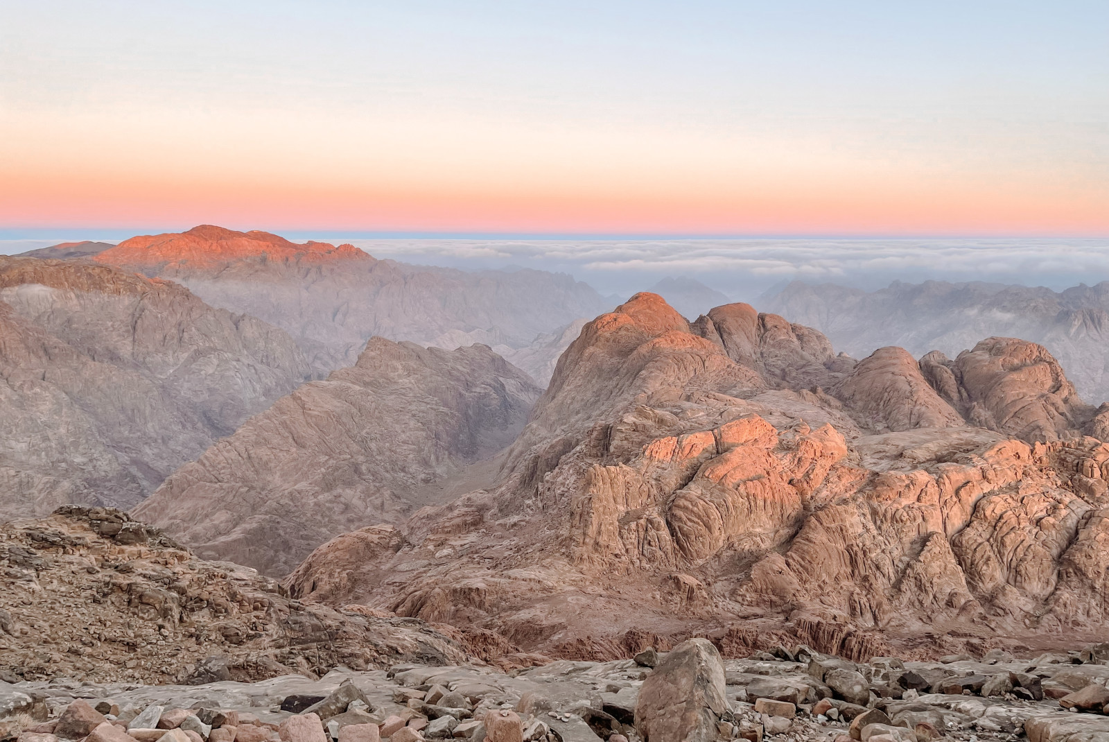 Mountains with pink and orange skies during sunrise