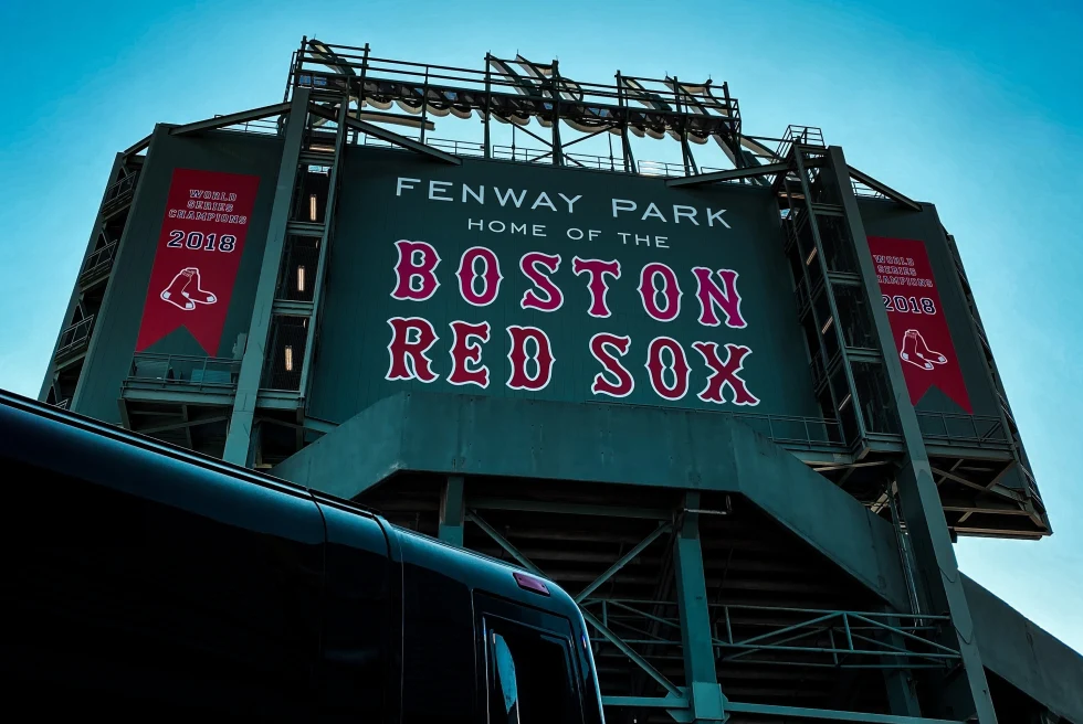 A green board displaying Fenway Park, Home of the Boston Red Sox stadium. 