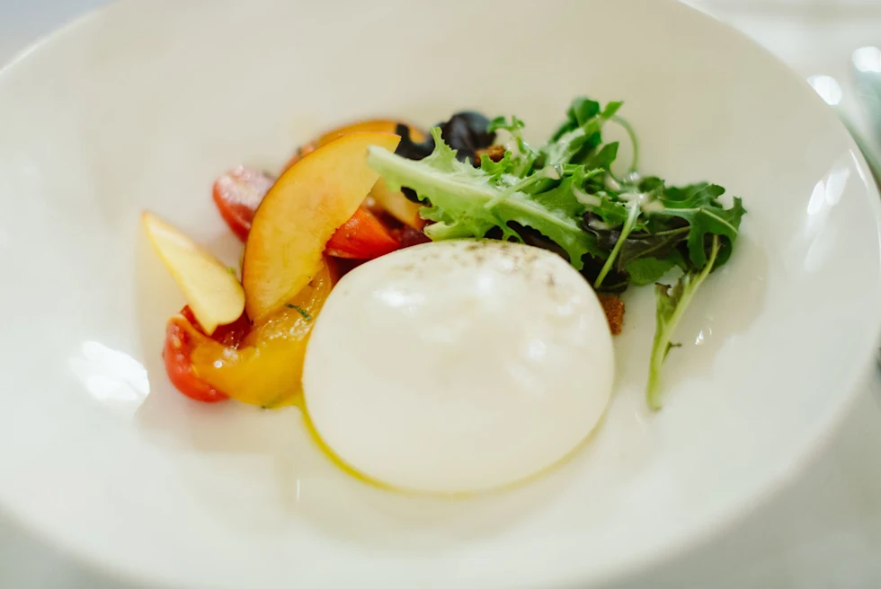 mozzerella, peach slices and greens