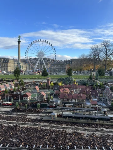 A miniature town model with a ferris wheel