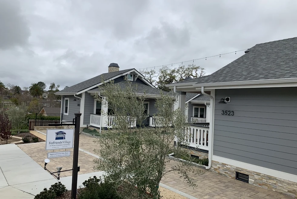 bungalow style houses on small inn property on a cloudy day