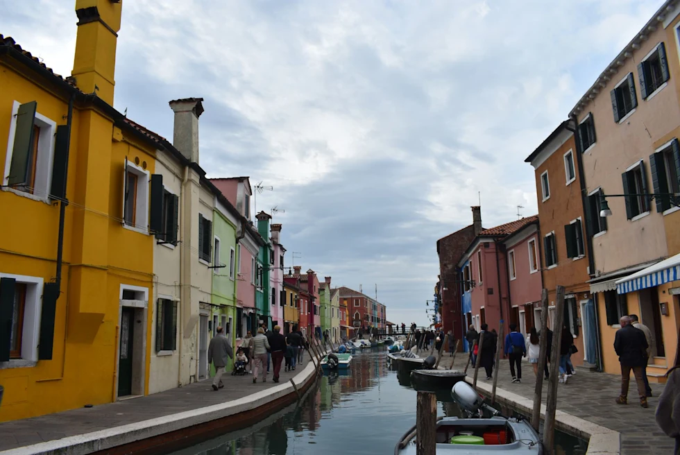 A canal with colorful buildings on its sides.