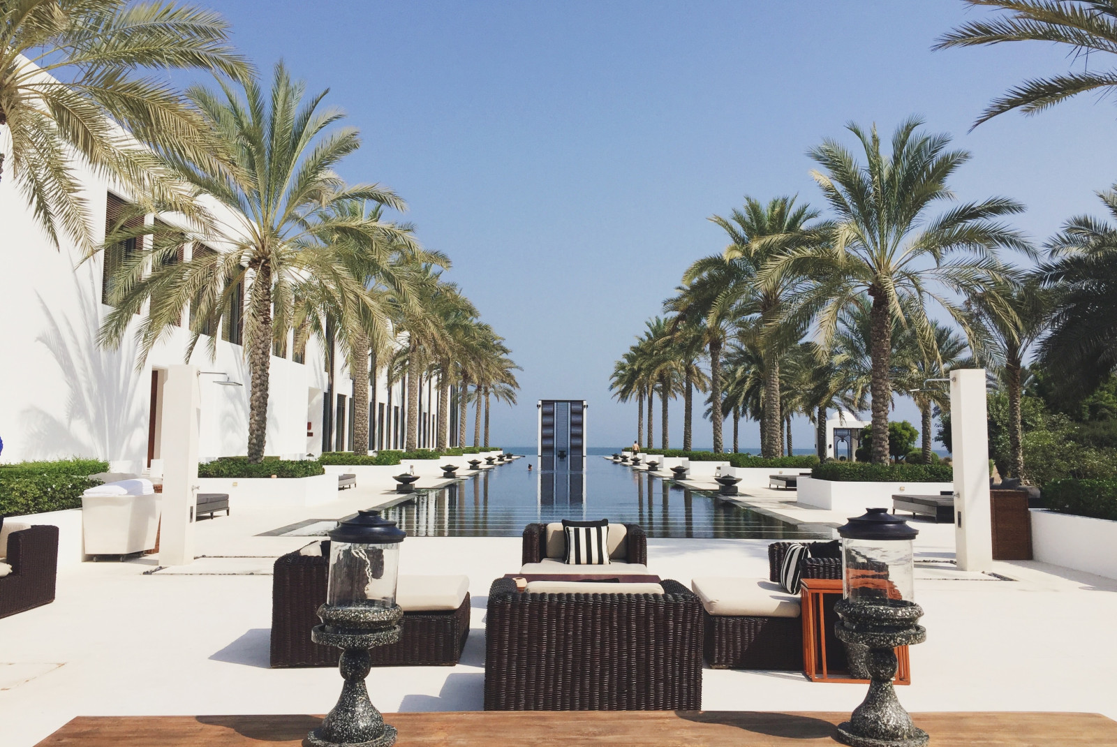 The long pool at The Chedi Muscat, Oman overlooking the water. 