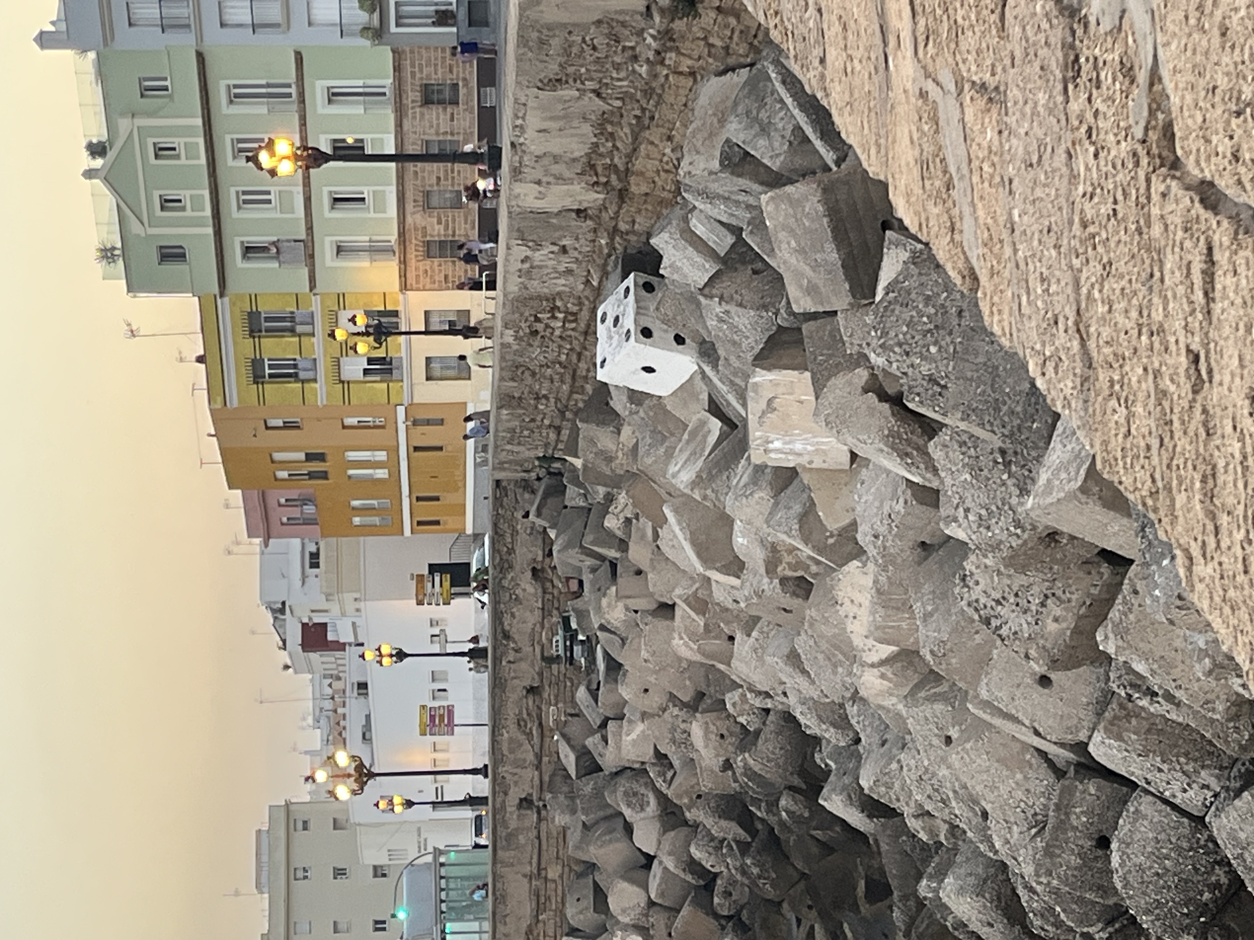 View of a canal-side rocks and houses