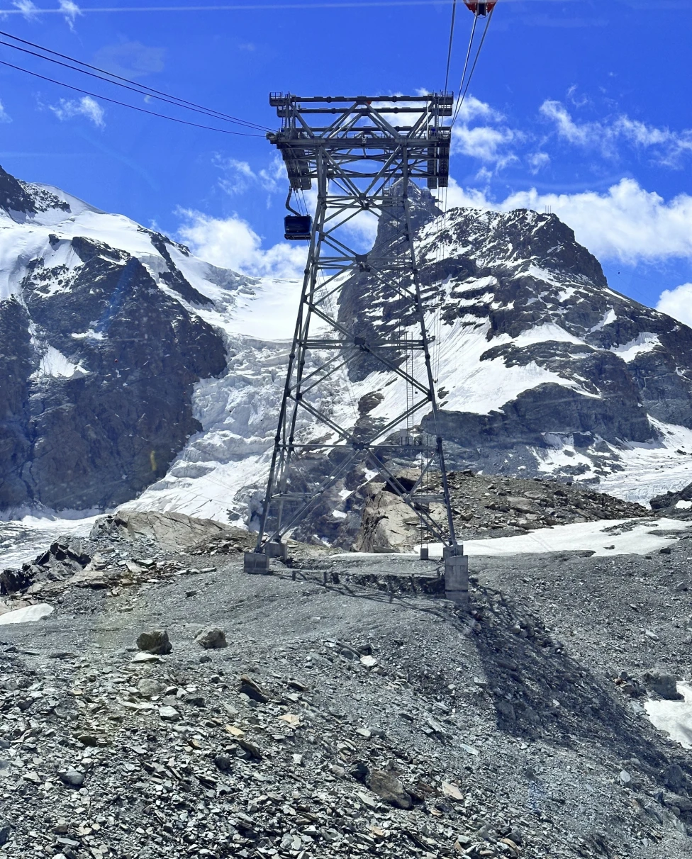 A picture of a cable car in Zermatt during daytime