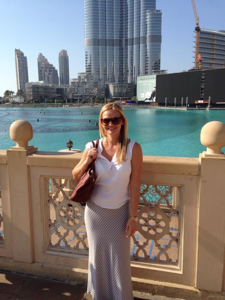 Travel advisor posing in front of Burj Khalifa