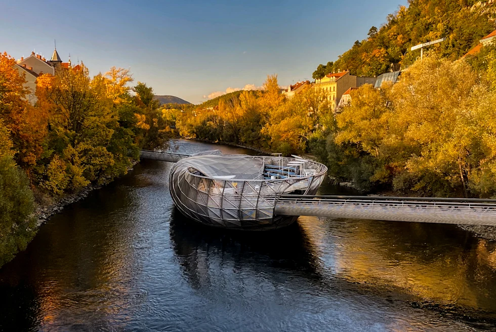 sculpture over river during daytime