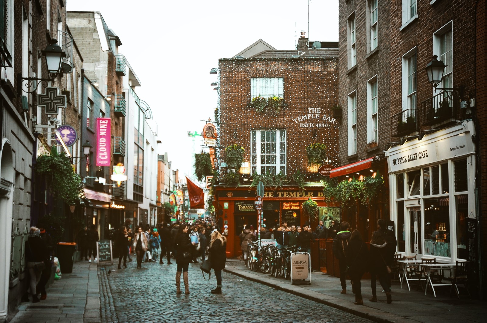 A busy street with pubs in Dublin, Ireland.