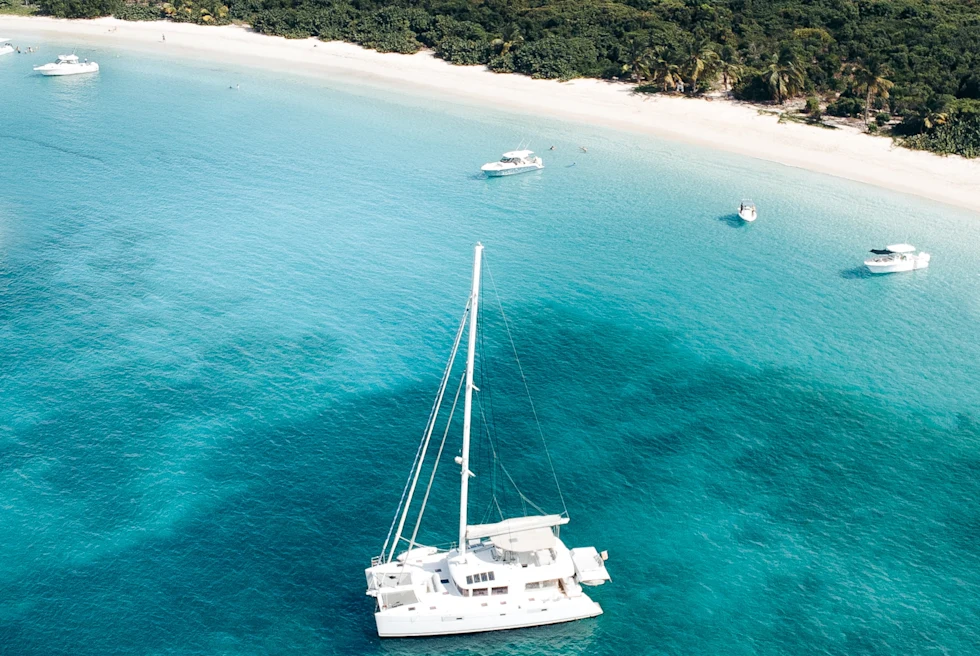 white boat on sea during daytime