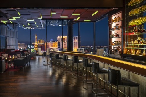dimly lit bar overlooking the Vegas Strip