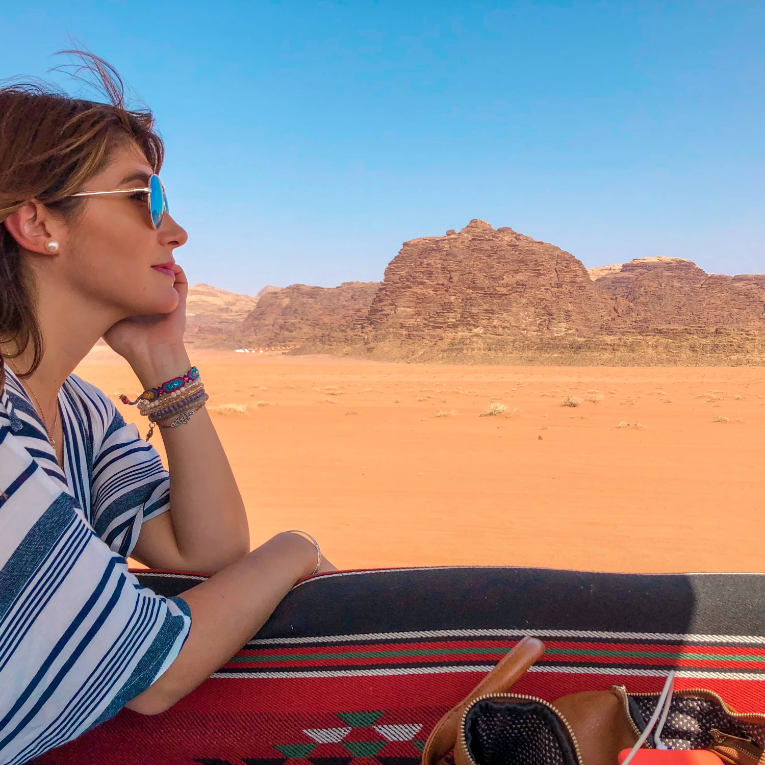 A woman posing in a desert