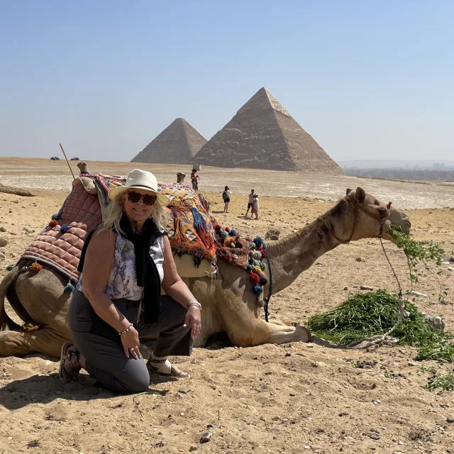 Travel advisor posing in a desert