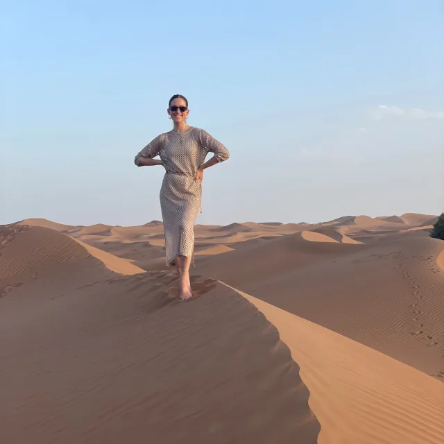Daryn Schwartz posing for a photo in a desert