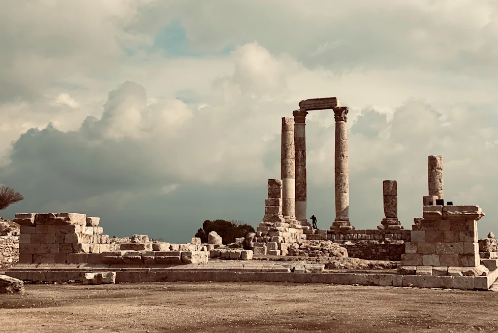 Citadel in Amman with white puffy clouds in the sky