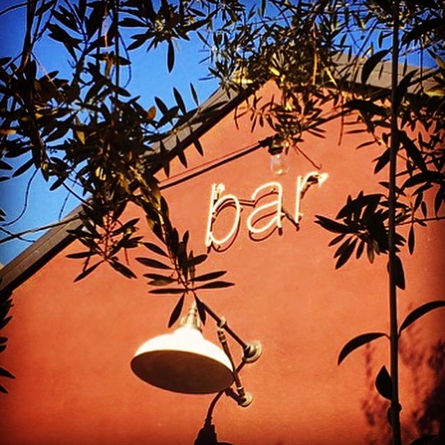 A brick wall with "bar" written on it