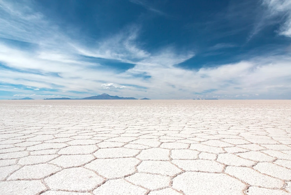 Dried desert covered with beautiful blue sky.