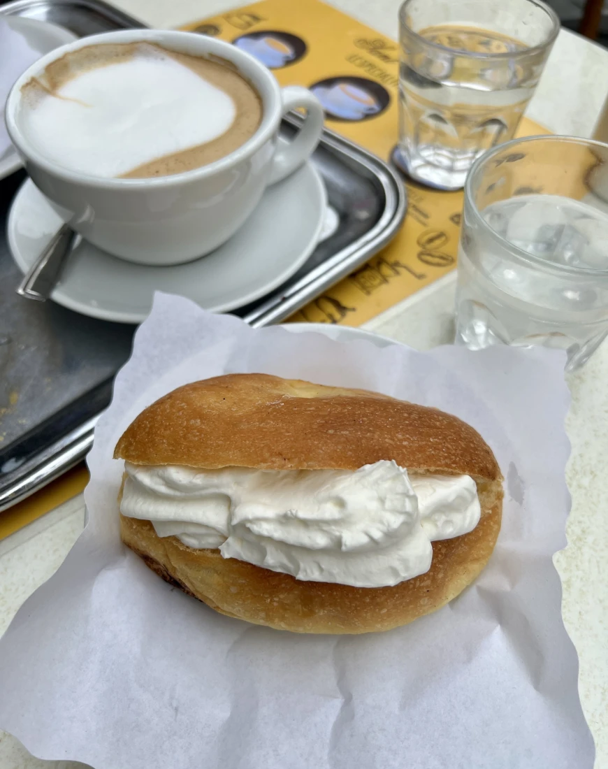 A pastry on white paper on a table
