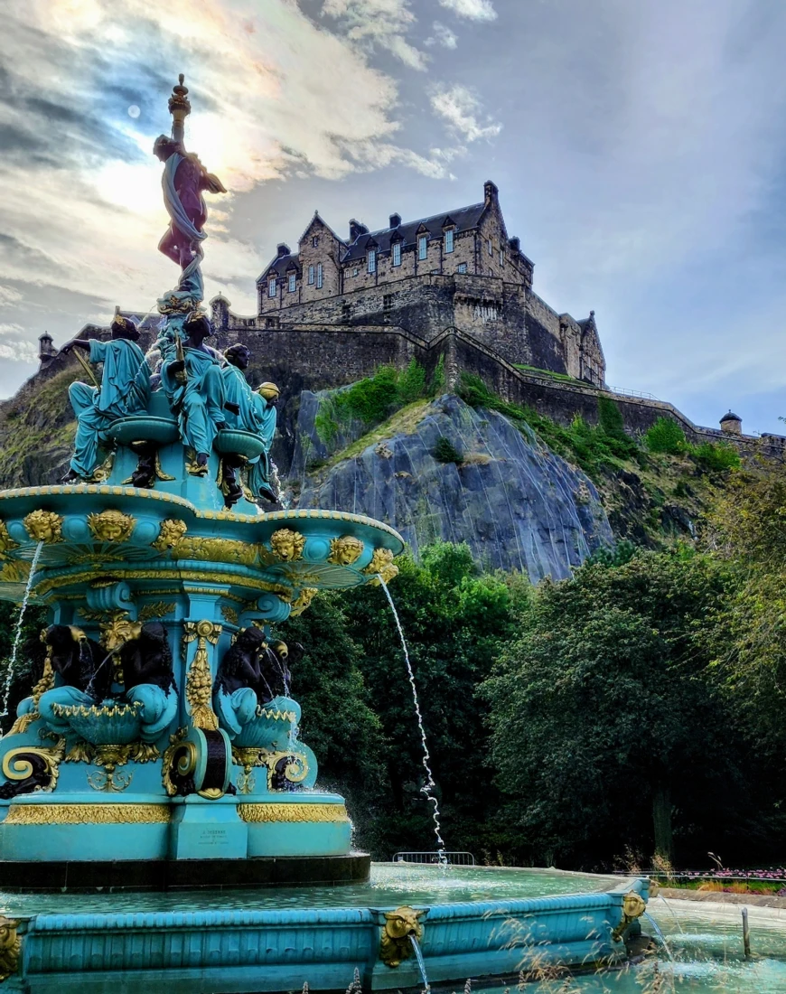 Keeping watch of the city, Edinburgh Castle looks regal from the fountain at Princes St Gardens