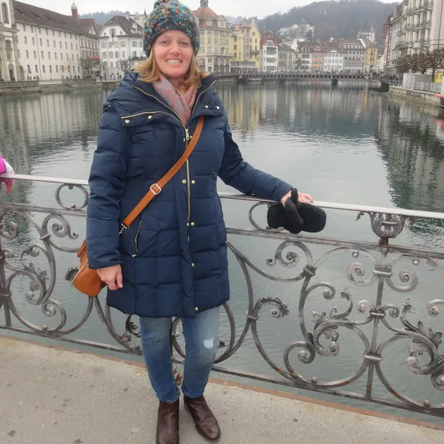 Travel advisor Michele Posa posing in front of a European river.