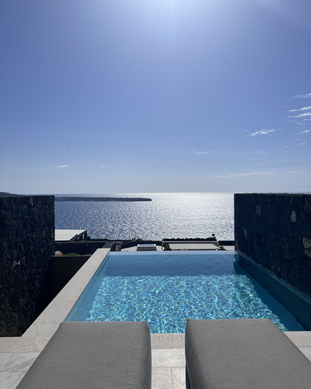 square infinity pool overlooking the ocean
