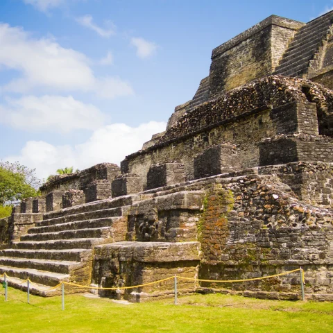 Ancient stone temple on a green plain 