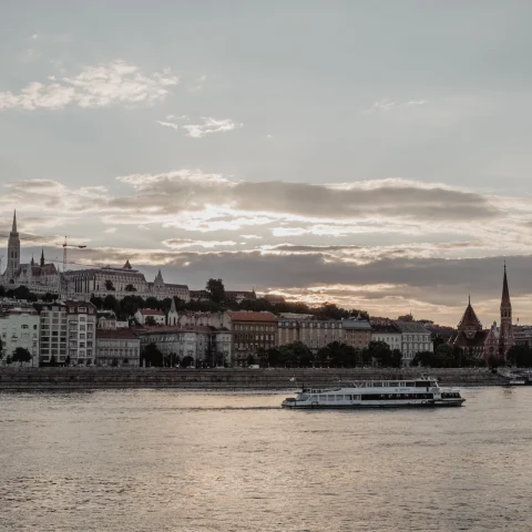 a river boat in front of Budapest