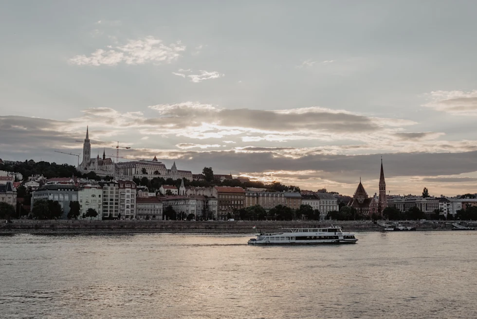 a river boat in front of Budapest