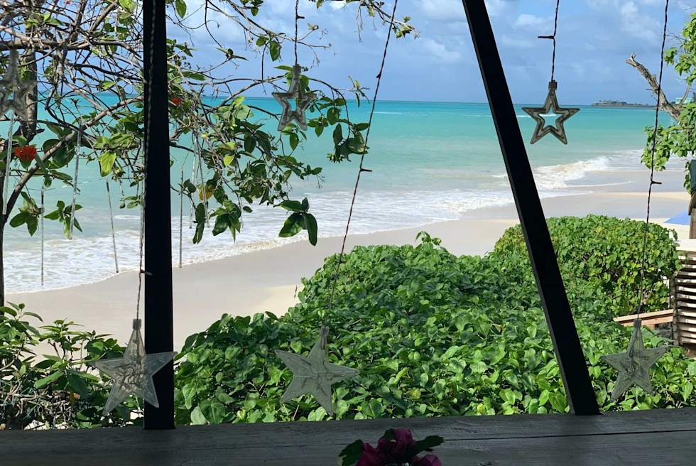 white sand beach from a beach house deck