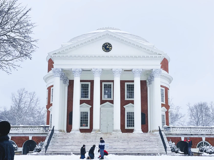 Rotunda building covered in snow with cloudy skies