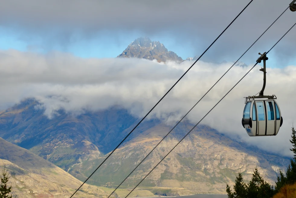 Gondola with mountains and clouds in Queenstown, NZ